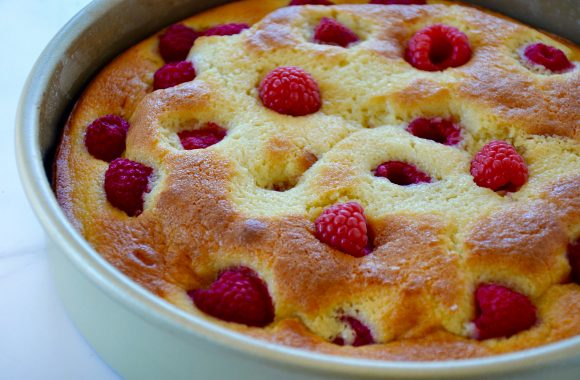 Freshly baked cream cheese coffee cake studded with raspberries 