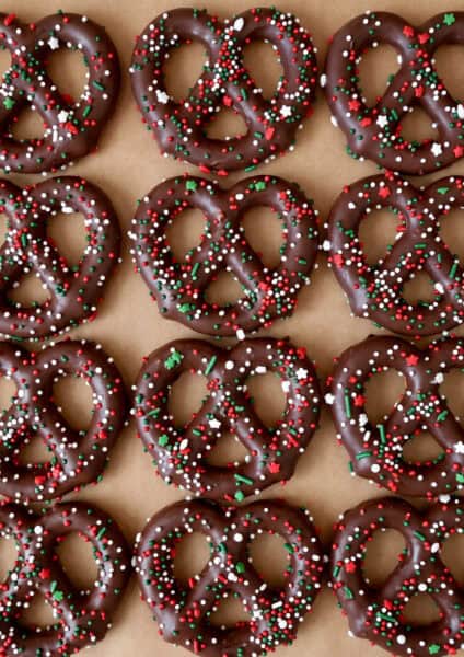Chocolate-covered pretzels with Christmas sprinkles.