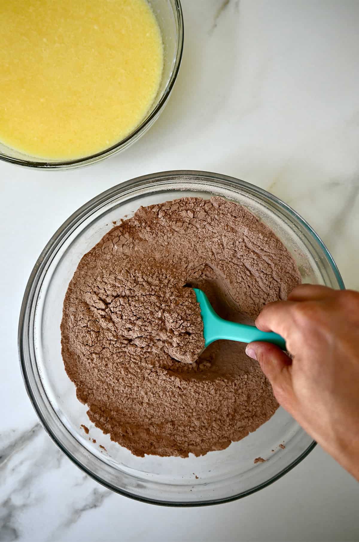 Wet and dry ingredients for chocolate doughnuts.
