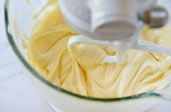 Stand mixer bowl containing cream cheese coffee cake batter.