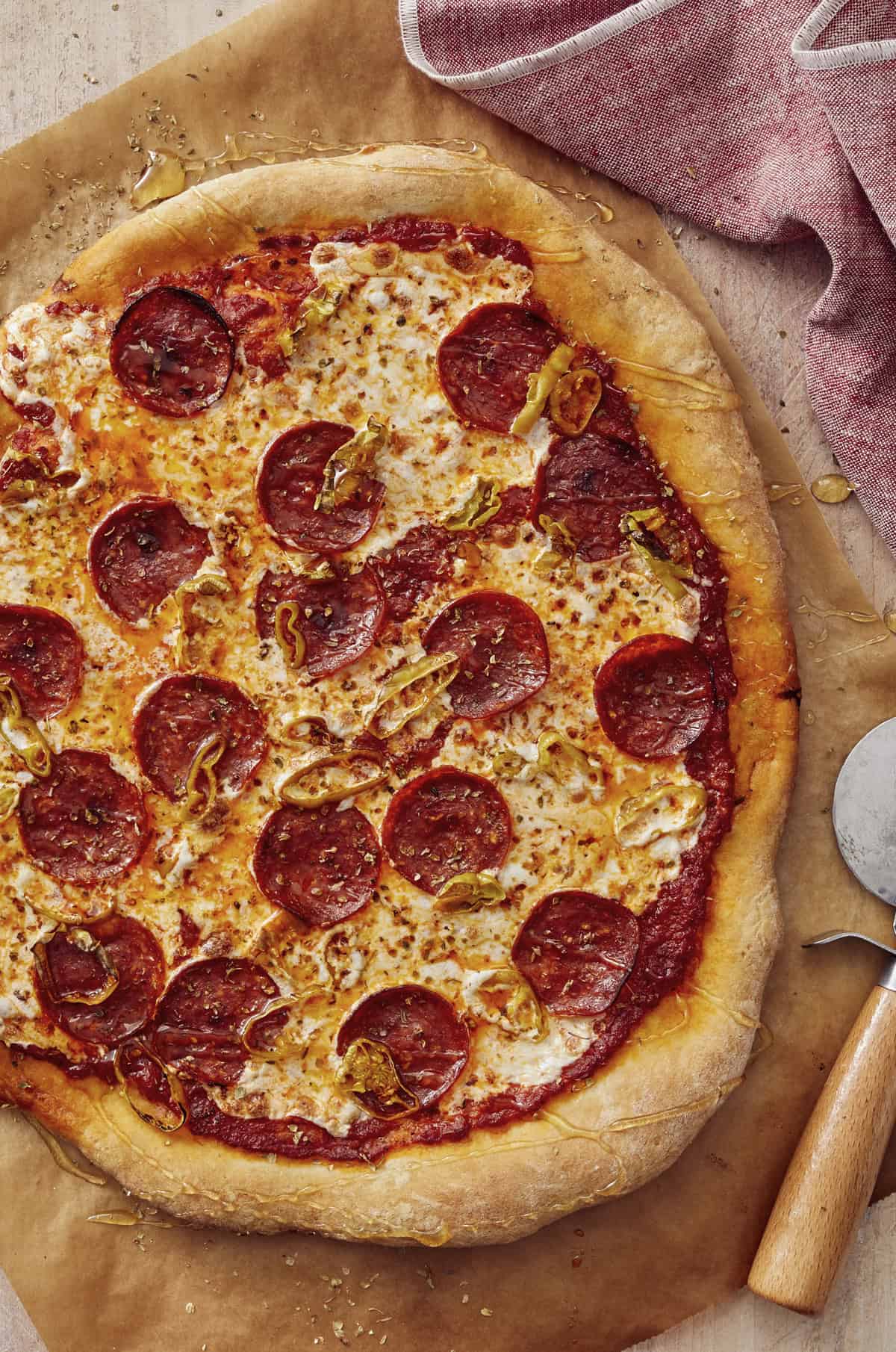 Pepperoni pizza with banana peppers drizzled with hot honey.