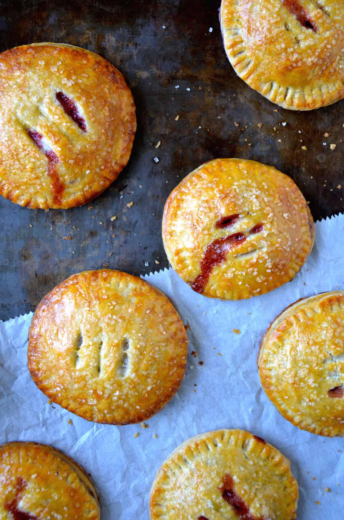 Strawberry Nutella hand pies topped with sanding sugar.