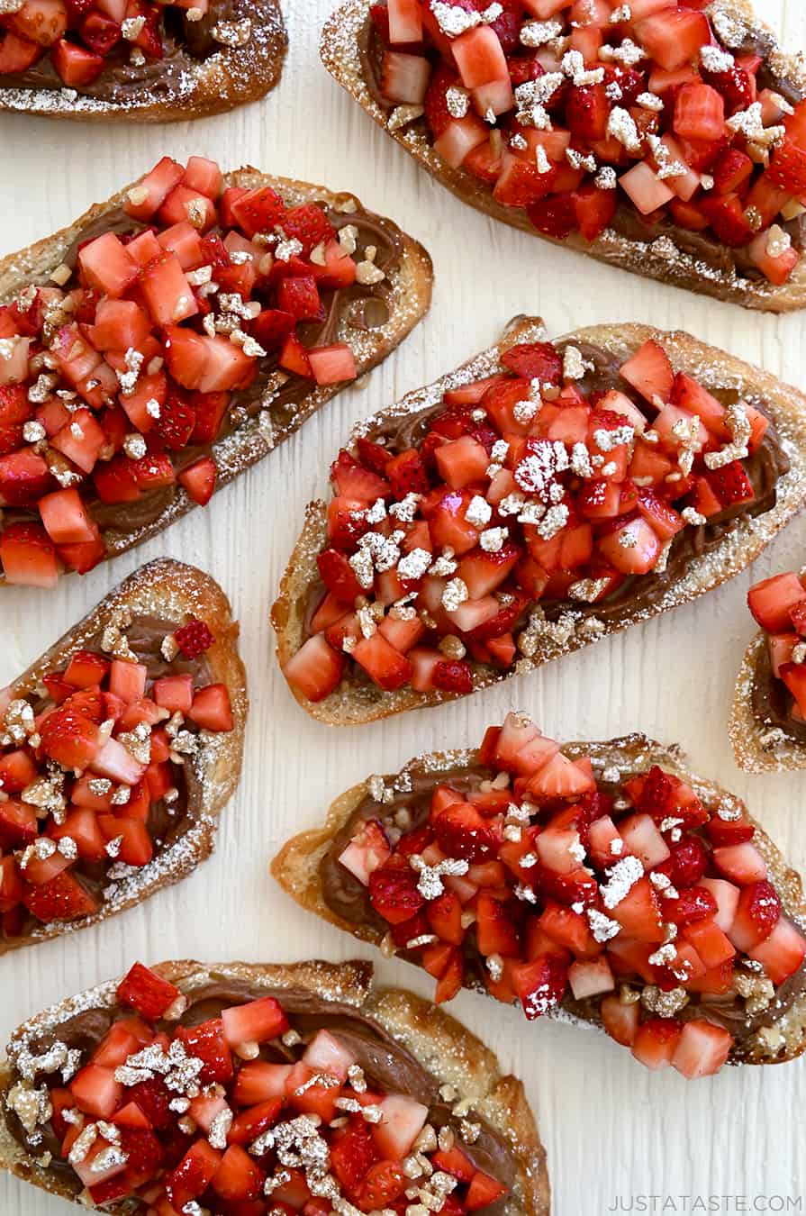 A top-down view of Strawberry Bruschetta starring Nutella, fresh strawberries and chopped walnuts