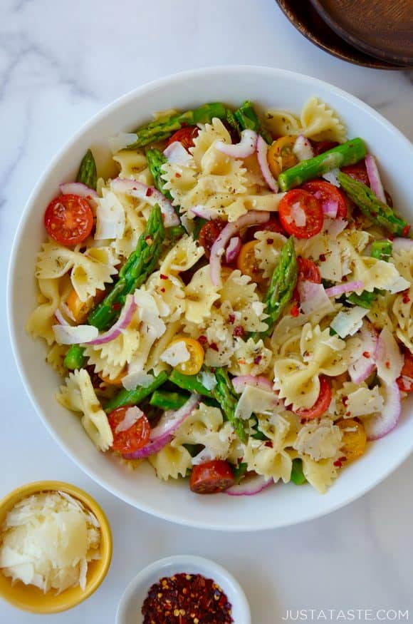 Large white bowl containing Asparagus Pasta Salad with Italian Dressing