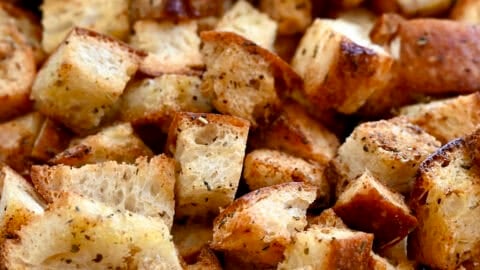 A close-up view of cubed homemade croutons.