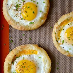 Cheesy Puff Pastry Baked Eggs recipe from justataste.com