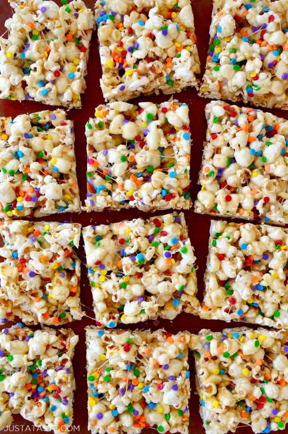 Squares of Funfetti Popcorn Treats made with marshmallows