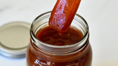Homemade barbecue sauce made with root beer in a mason jar.