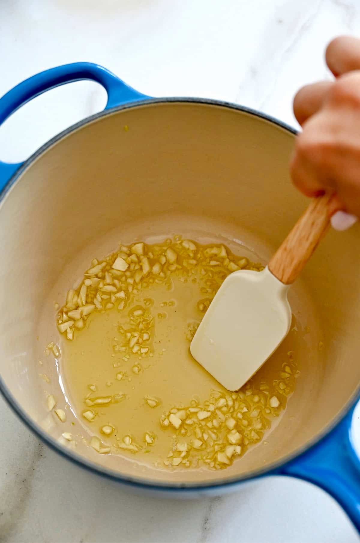 Sautéed garlic in olive oil in a medium saucepan.