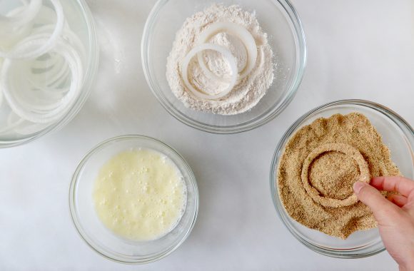 Bowls of breading ingredients for baked onion rings