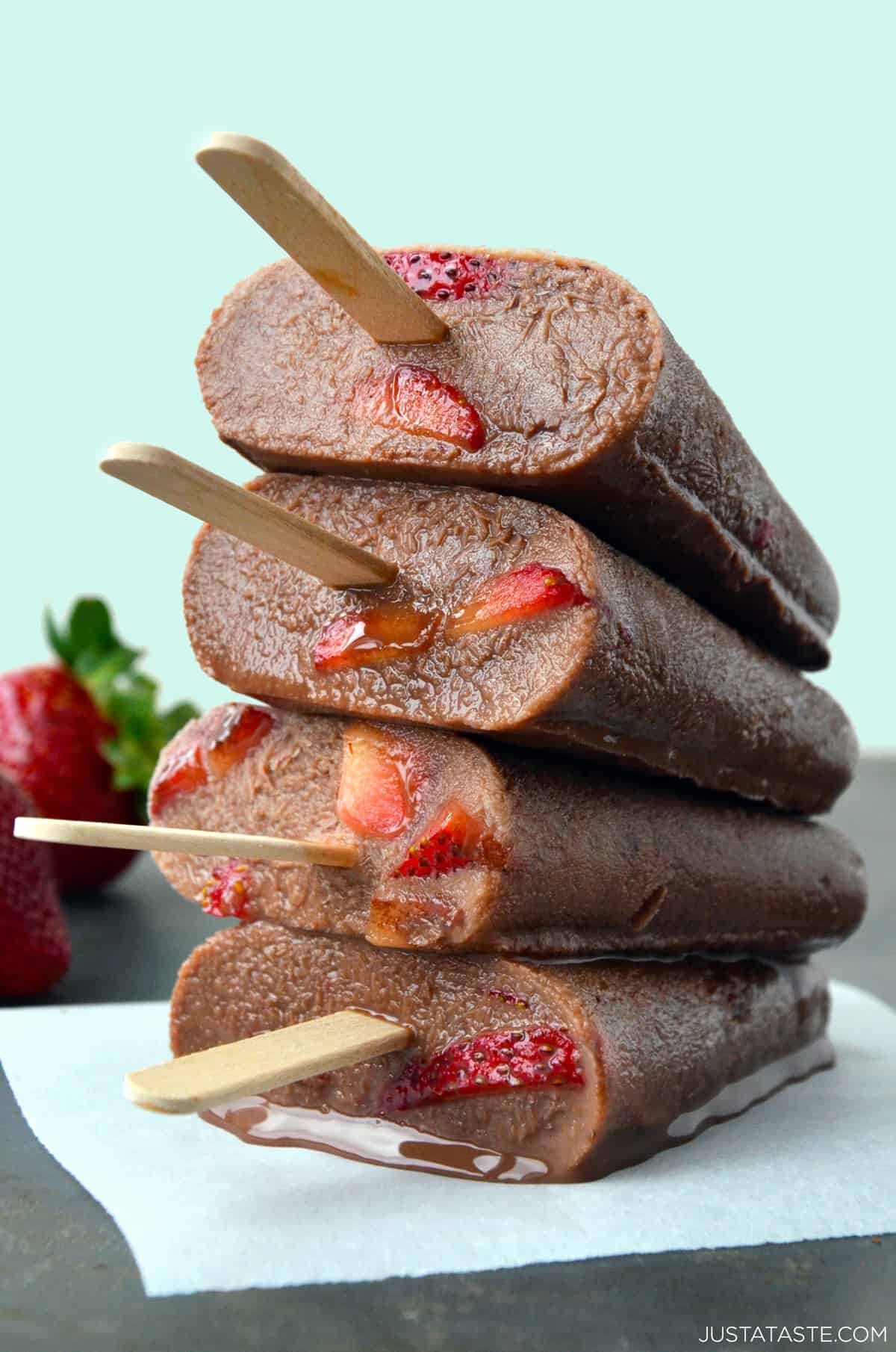 Chocolate-strawberry fudgesicles stacked four high.