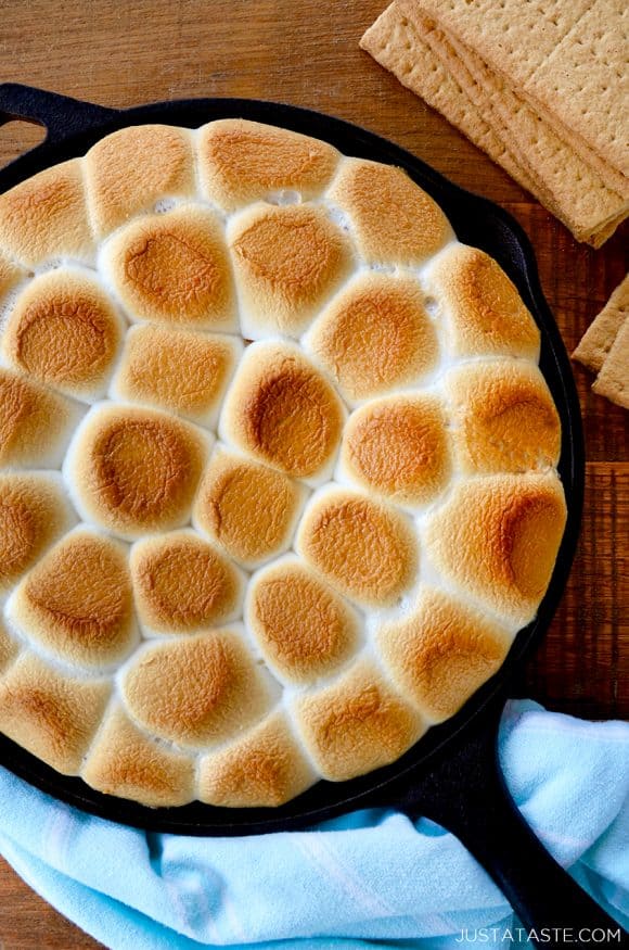 A cast-iron skillet containing toasted marshmallows