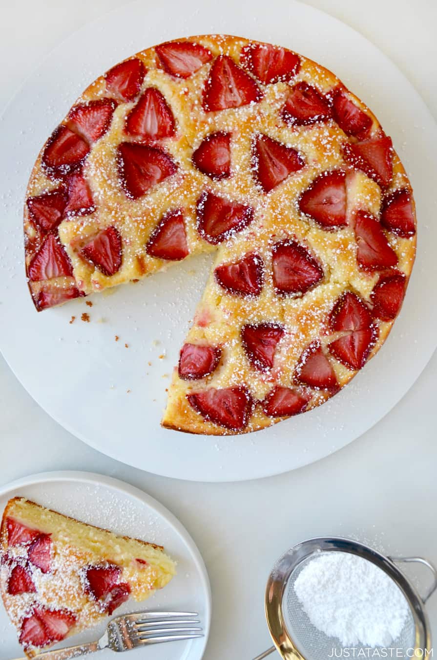 Top down view of Strawberry Cream Cheese Coffee Cake next to a plate with a slice of coffee cake