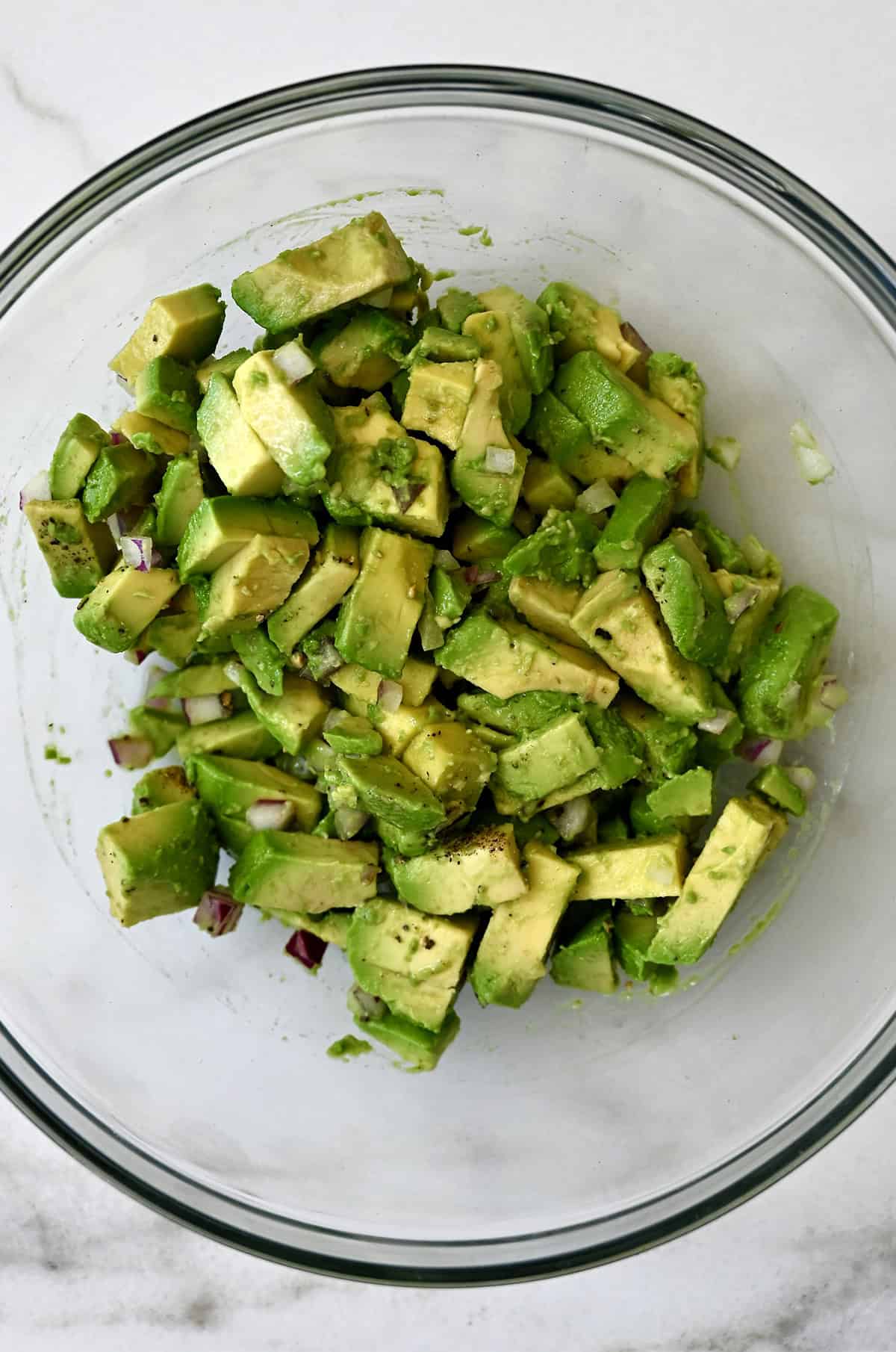 Avocado egg roll filling in a glass bowl.