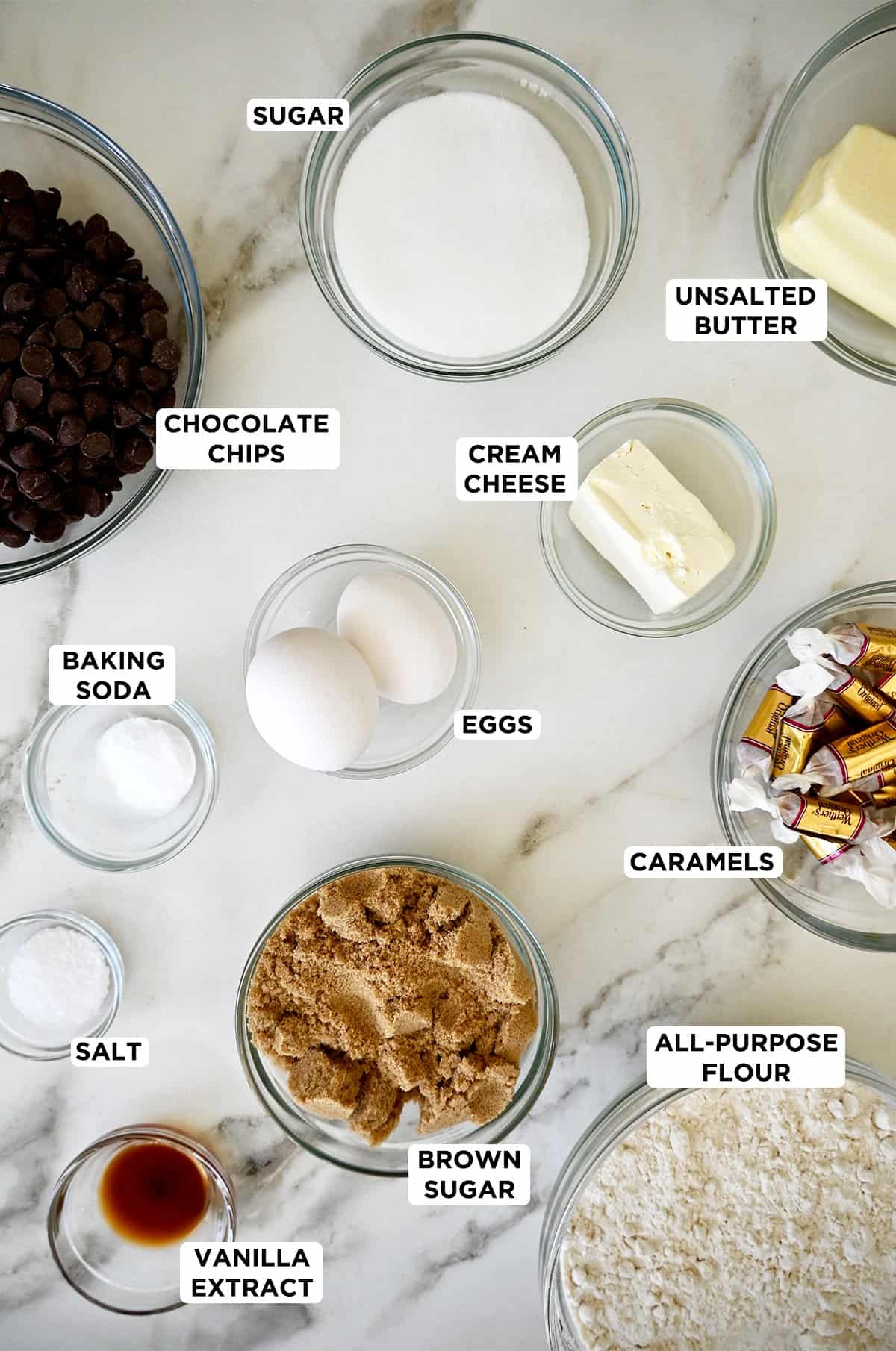 Ingredients for making chocolate chip cookies stuffed with soft caramels.
