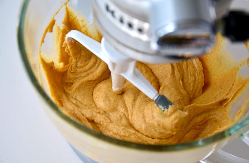 Batter in a stand mixer bowl with the paddle attachment