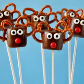 Chocolate-covered marshmallows with candy eyes, red candy noses and pretzel "antlers" made to look like Santa's reindeer.