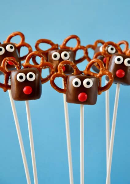 Chocolate-covered marshmallows with candy eyes, red candy noses and pretzel "antlers" made to look like Santa's reindeer.