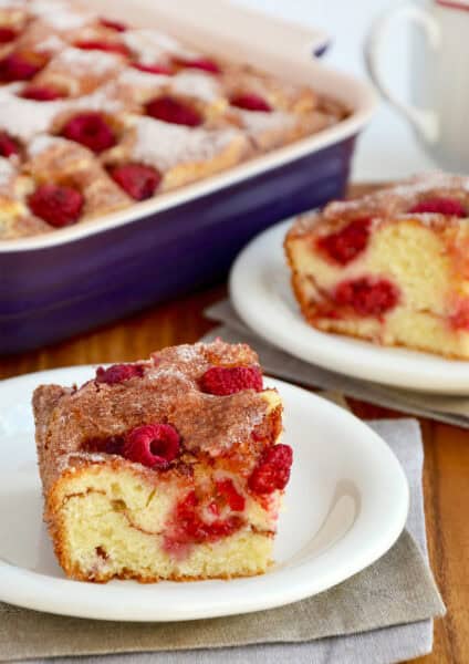 Raspberry sour cream coffee cake on a small white plate.