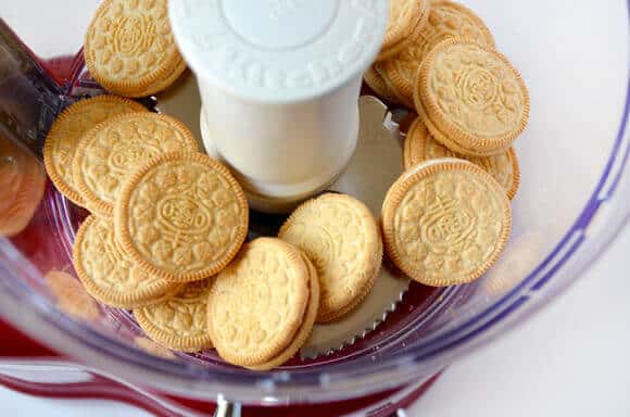 A top-down view of vanilla Oreos in a food processor