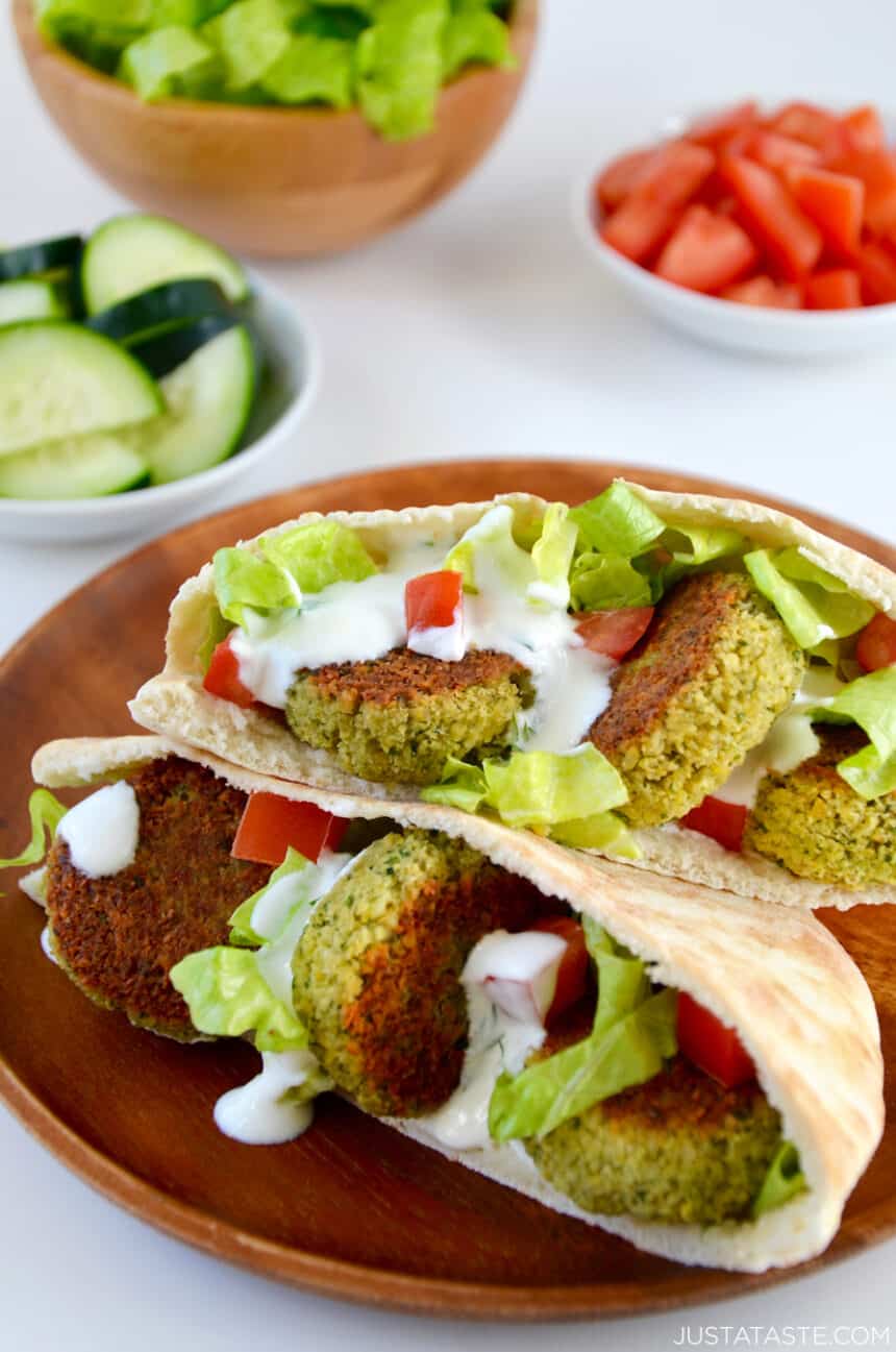 Crispy Homemade Baked Falafel tucked into pita pockets with lettuce, tomatoes and homemade tahini dressing