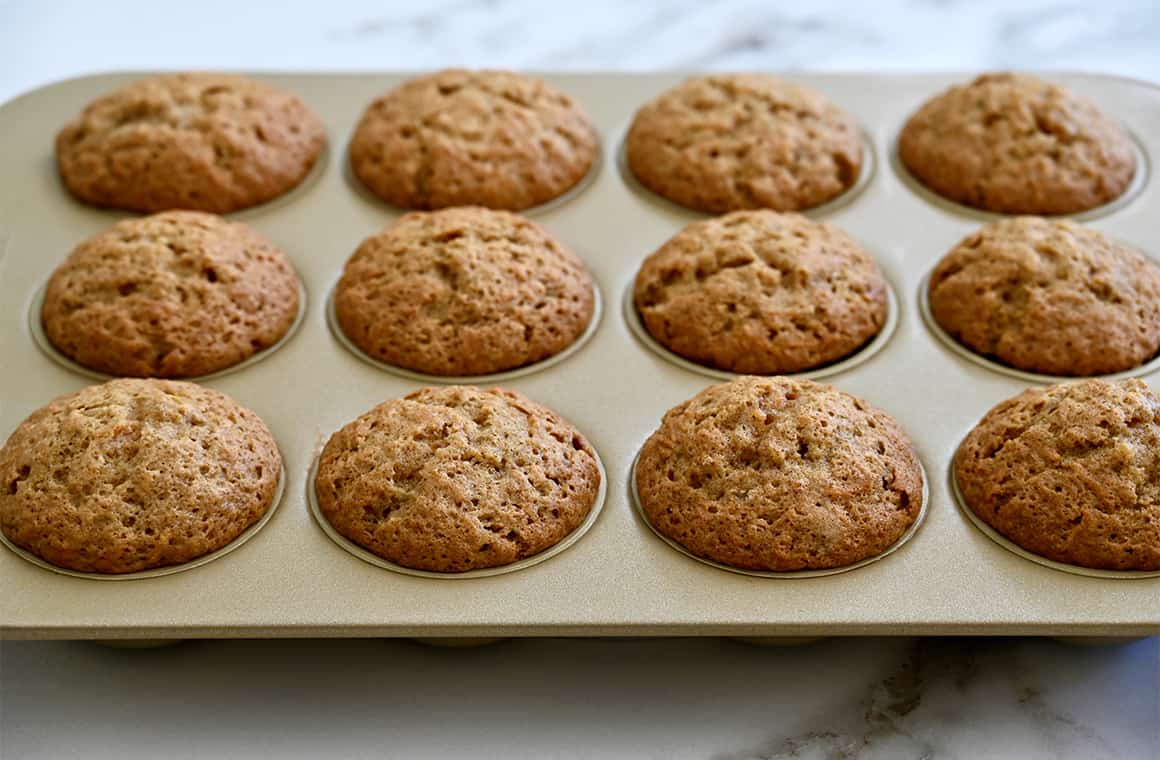 Baked cupcakes in a muffin tin.