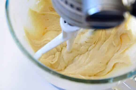 Glazed Lemon Bread mixture in clear stand mixer bowl