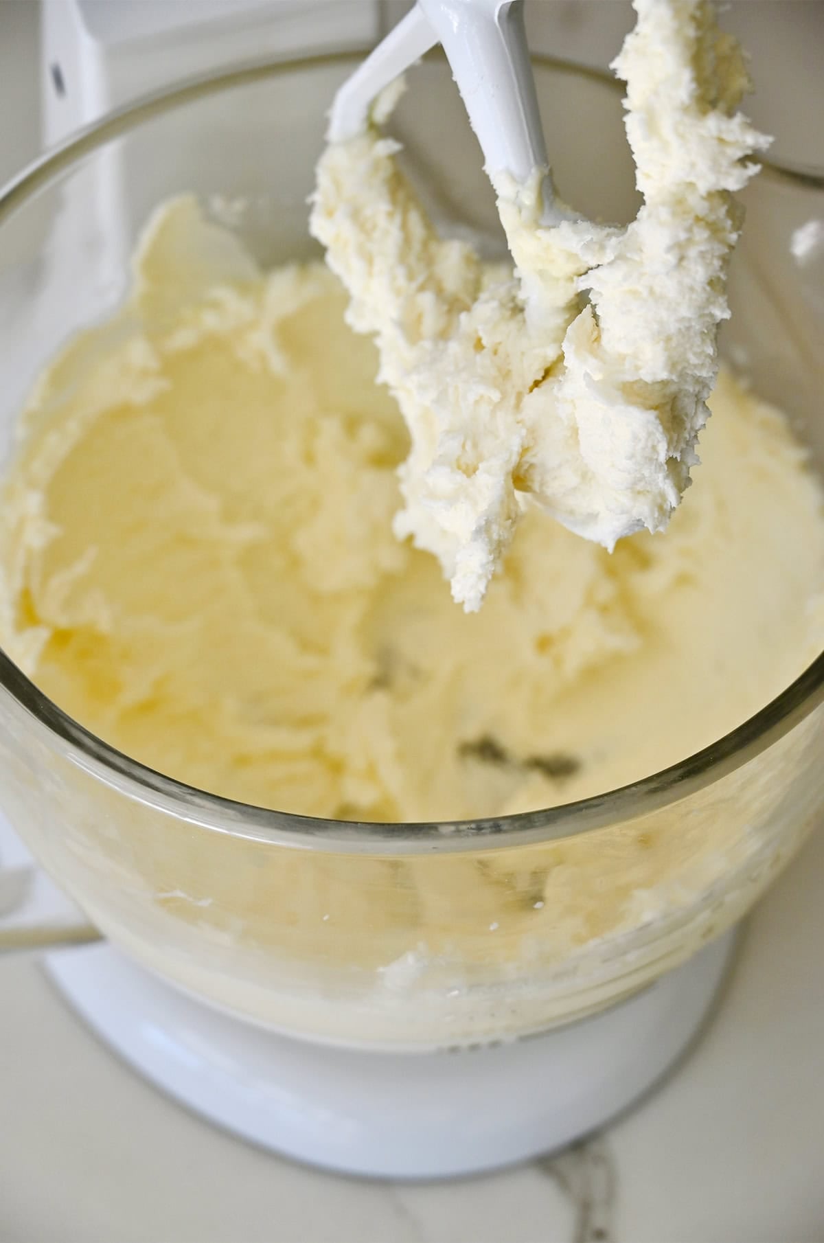 Creamed butter and sugar in the bowl of a stand mixer.