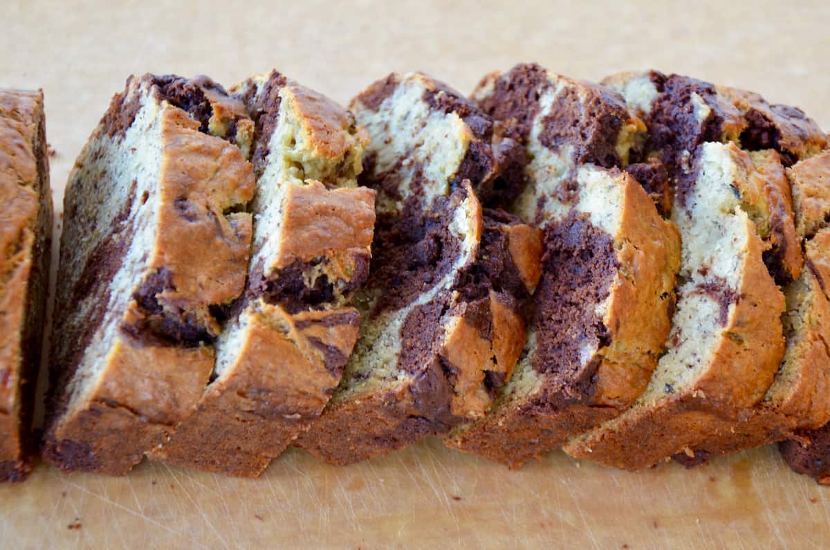 A sliced loaf of chocolate swirl banana bread.