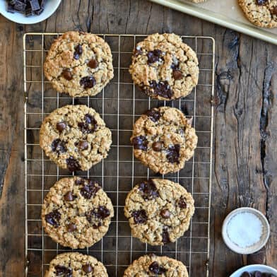 A top-down view of soft and chewy Flourless Oatmeal Chocolate Chip Cookies cooling on a wire rack