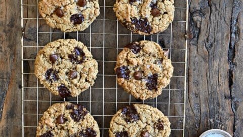 A top-down view of soft and chewy Flourless Oatmeal Chocolate Chip Cookies cooling on a wire rack