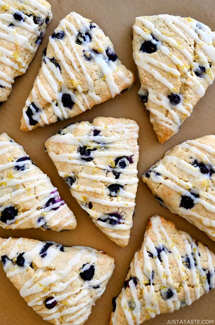 A close-up view of lemon glazed blueberry scones