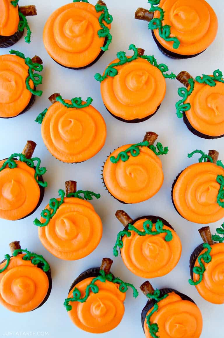 Chocolate Halloween cupcakes with orange frosting to look like a pumpkin patch.