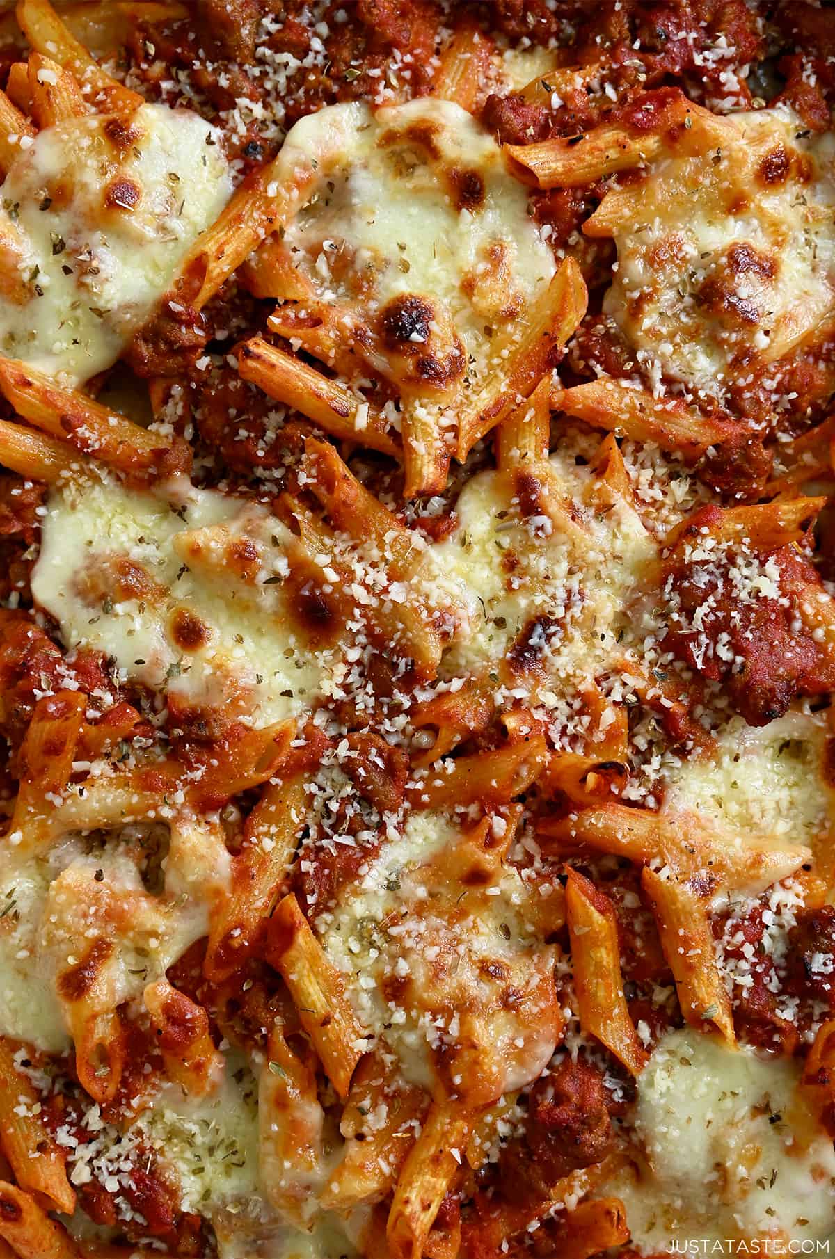 Baked penne pasta with golden brown mozzarella and freshly grated Parmesan cheese.
