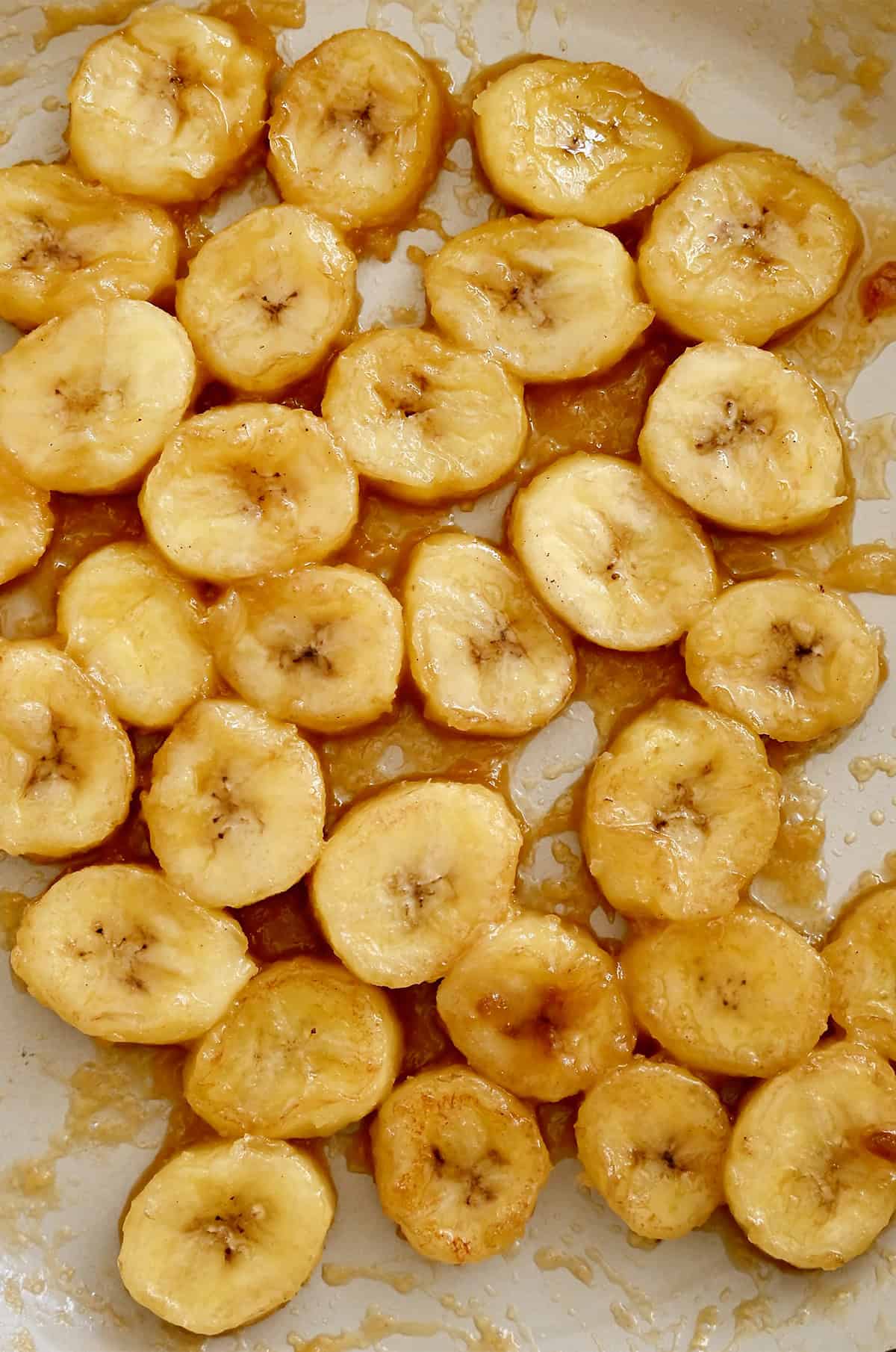 Jammy caramelized bananas in a large skillet.