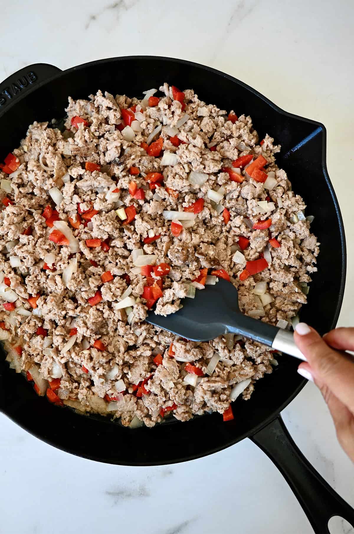 Browned ground chicken with diced onion, red bell pepper and minced garlic.