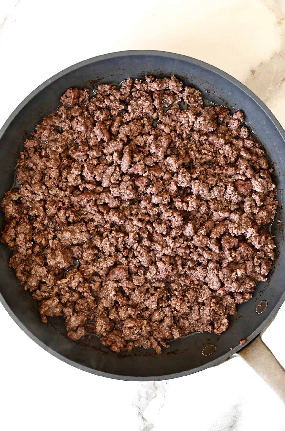 Browned ground beef in a large nonstick skillet.