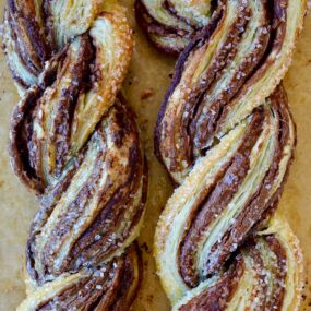 A close-up of Nutella twists made with puff pastry and sanding sugar on top