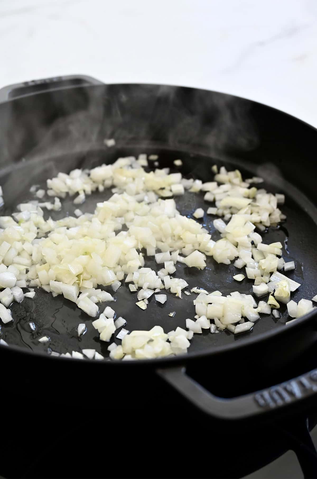 Sautéed onions in a cast iron skillet.