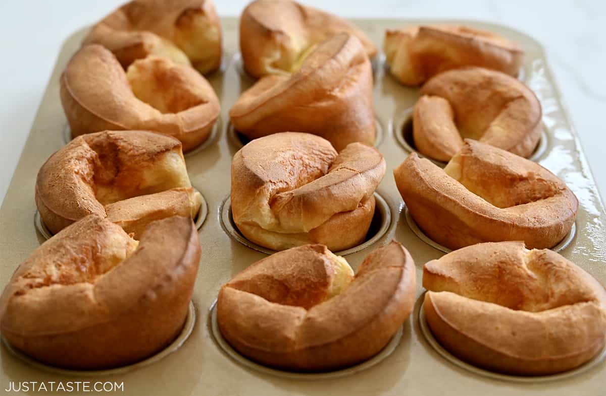 Tall, eggy muffin pan popovers in a Goldtouch muffin pan.