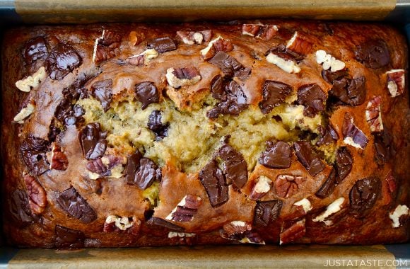 A close-up view of banana bread made with Greek yogurt, pecans and chocolate chunks