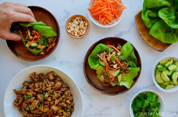 Spread of Chinese Chicken Lettuce Wraps and sliced veggies