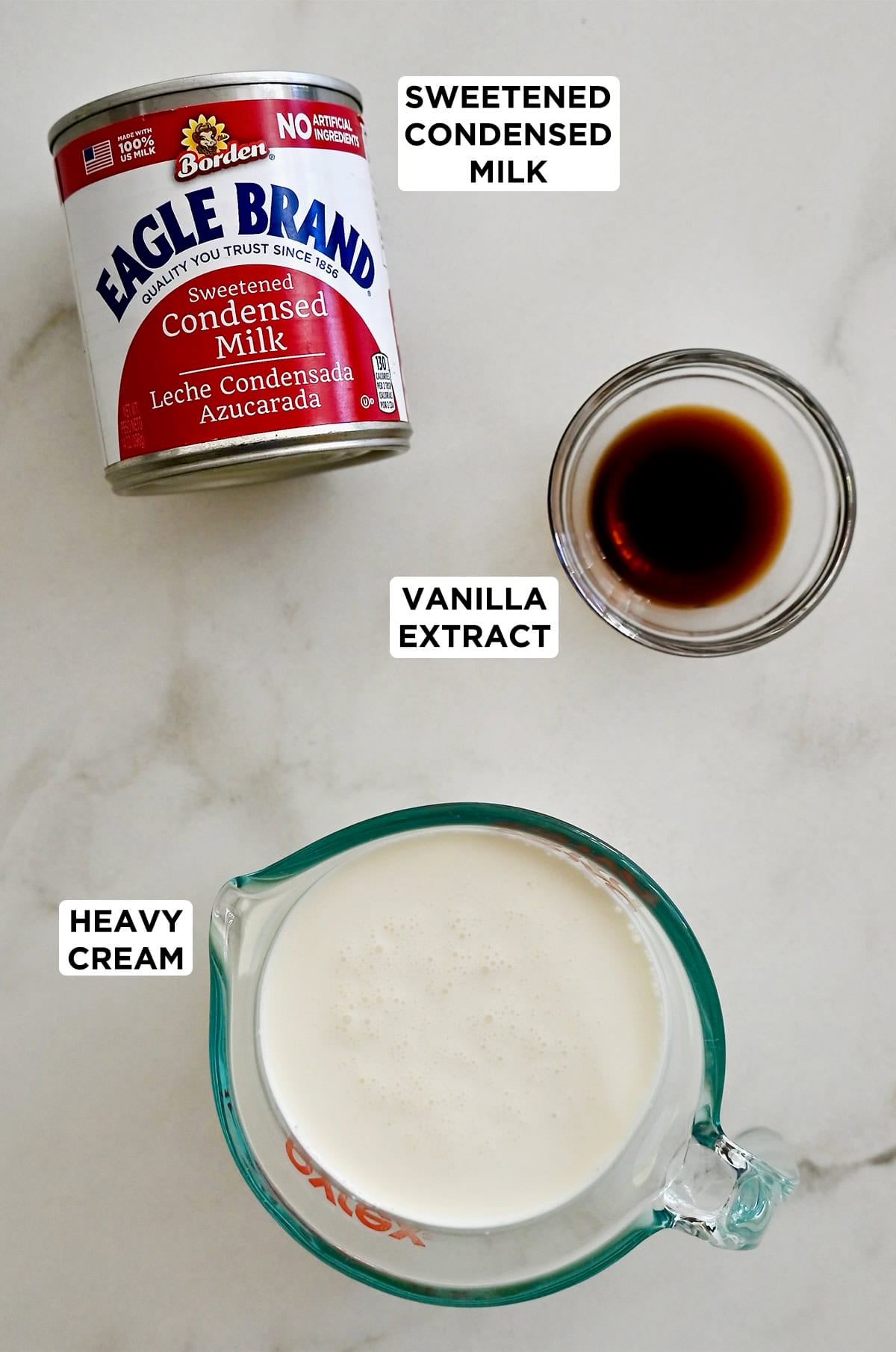 The three ingredients to make no-churn ice cream: heavy whipping cream, vanilla extract and sweetened condensed milk.