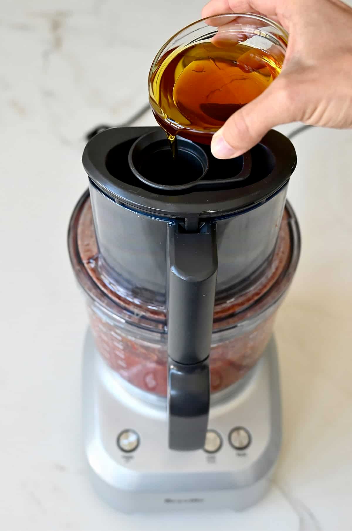 Streaming in olive oil and vinegar to make a rich, creamy gazpacho without dairy.