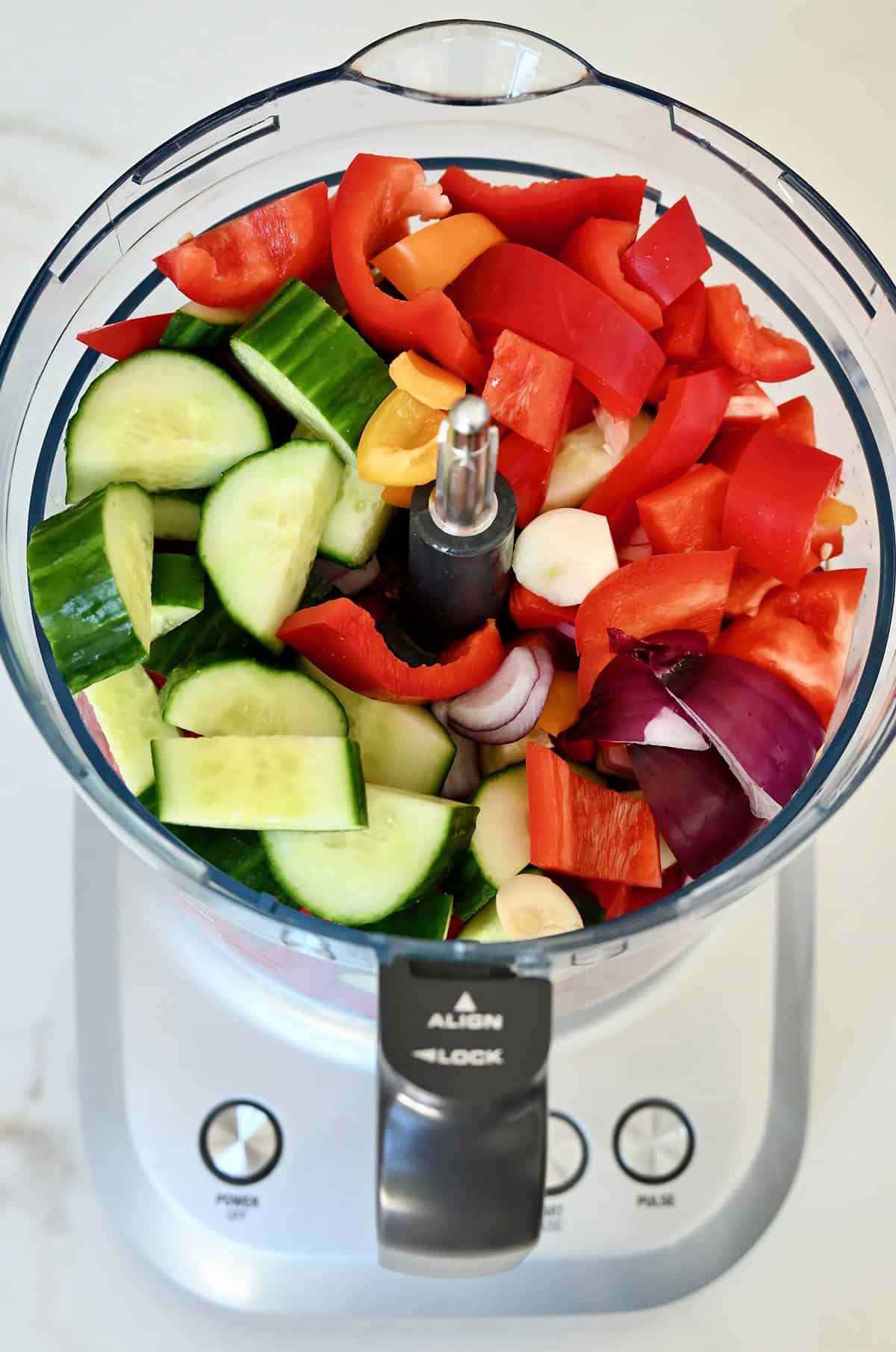 Chopped veggies in a food processor.