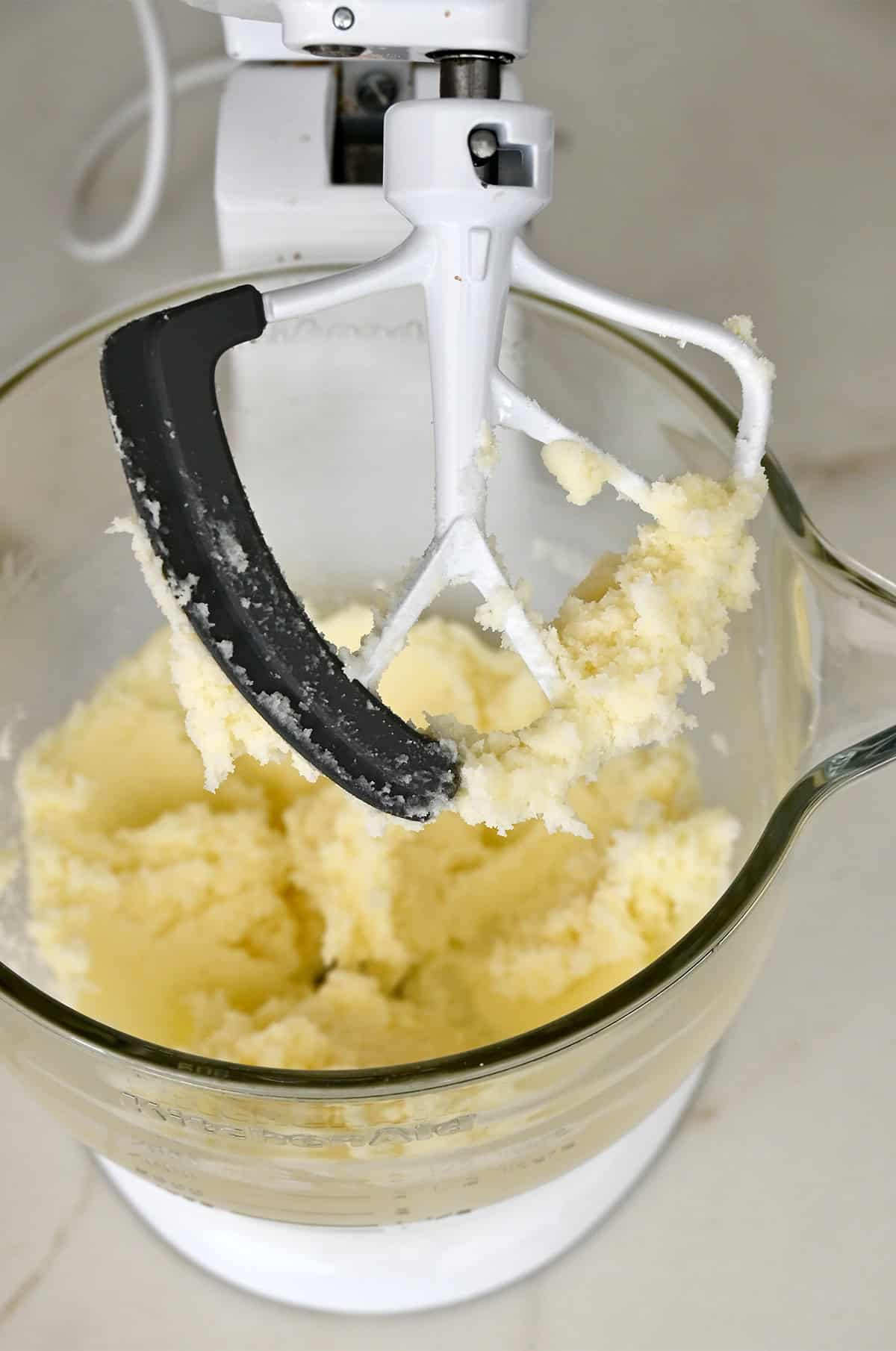Creamed butter, cream cheese and sugar in the bowl of a stand mixer fitted with the paddle attachment.