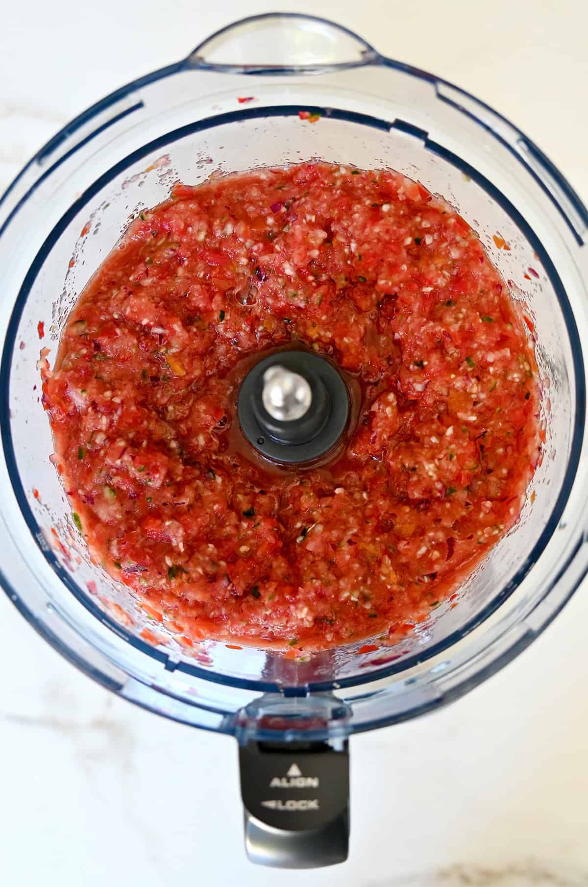Gazpacho in a food processor before emulsifying with olive oil.