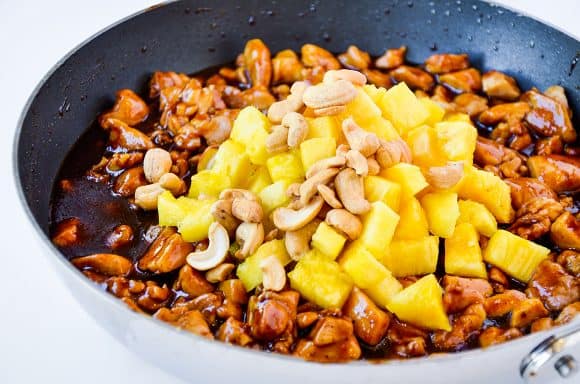 Pineapple and cashews atop sautéed chicken thighs