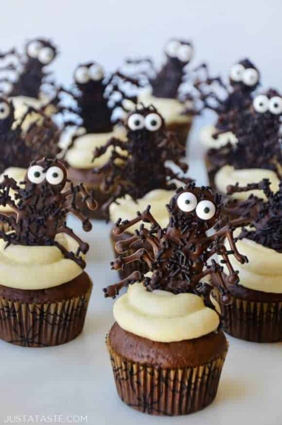 Chocolate Halloween Cupcakes topped with cream cheese frosting and chocolate spiders 