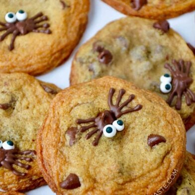 A close-up of Spider Chocolate Chip Cookies stacked on top of each other